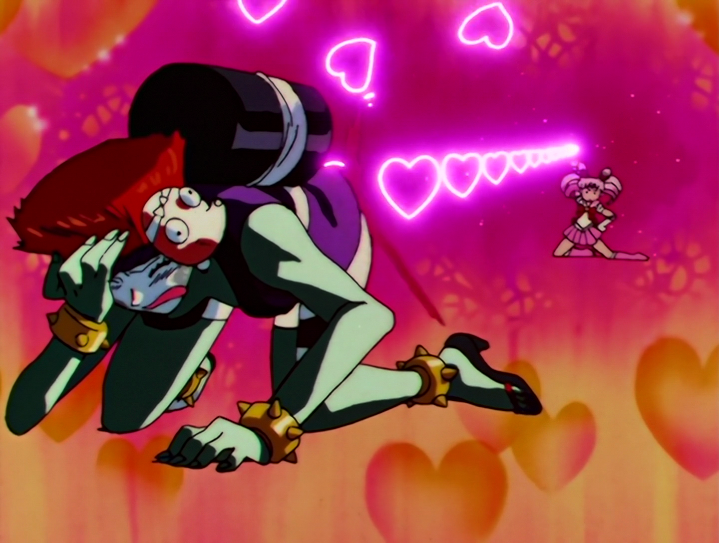 Okay, I had to include this picture of Soiya getting the full force of the Pink Sugar Heart attack. She’s on her knees and despairing as Sailor Chibi Moon, in the distance, aims a stream of pink hearts at her ass. It is not a dignified sight.